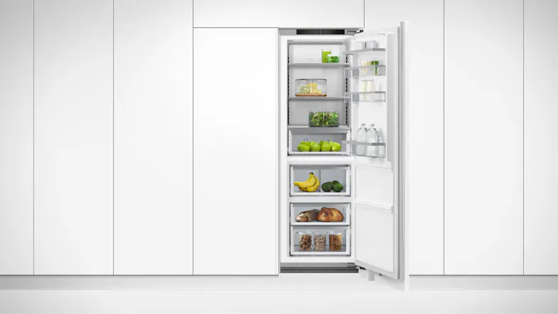 A view of the fridge installed flush on a clean white wall A view of the fridge installed flush on a clean white wall