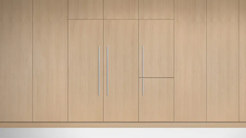 A view of the fridge and its compatible freezer installed flush on a light wooden wall A view of the fridge and its compatible freezer installed flush on a light wooden wall
