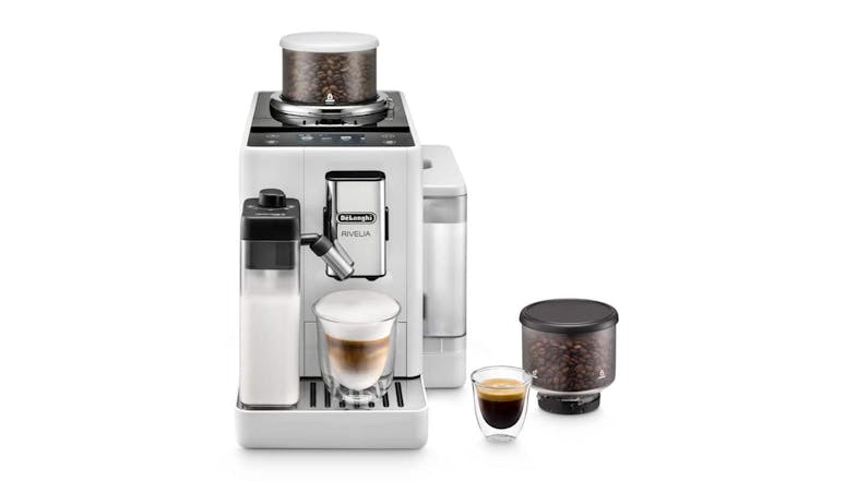 De’Longhi Rivelia Arctic White espresso machine with milk frother, coffee beans in hopper, and two cups of coffee De’Longhi Rivelia Arctic White espresso machine with milk frother, coffee beans in hopper, and two cups of coffee