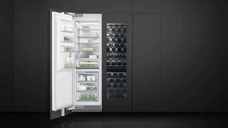 Modern kitchen with integrated wine fridge and open refrigerator, both built into matte black cabinetry Modern kitchen with integrated wine fridge and open refrigerator, both built into matte black cabinetry