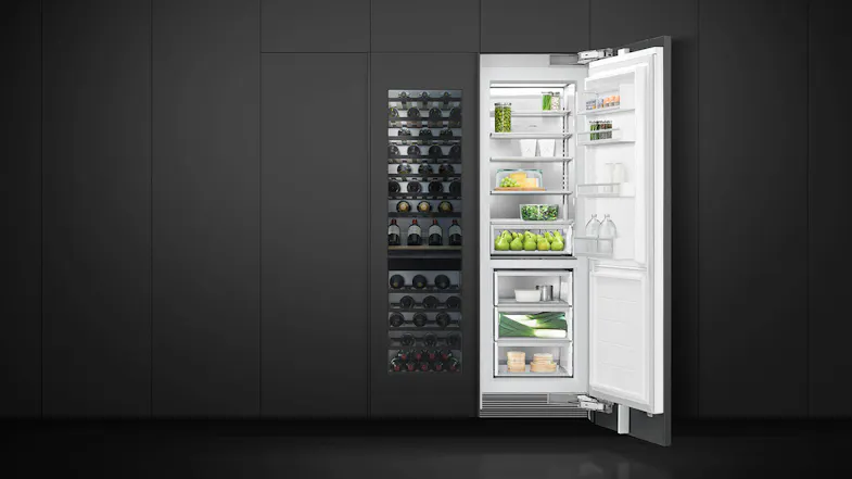 Contemporary kitchen with dark wood cabinetry featuring an integrated wine fridge and built-in ovens Contemporary kitchen with dark wood cabinetry featuring an integrated wine fridge and built-in ovens