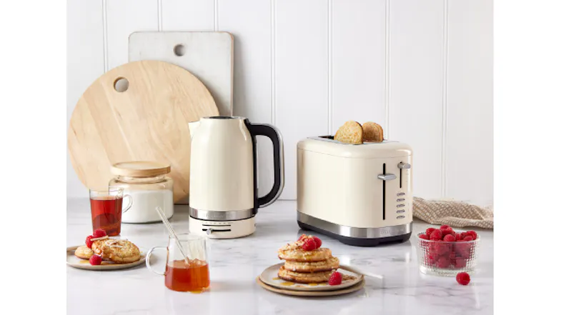 The toaster displayed on a marbled kitchen countertop with its matching kettle The toaster displayed on a marbled kitchen countertop with its matching kettle