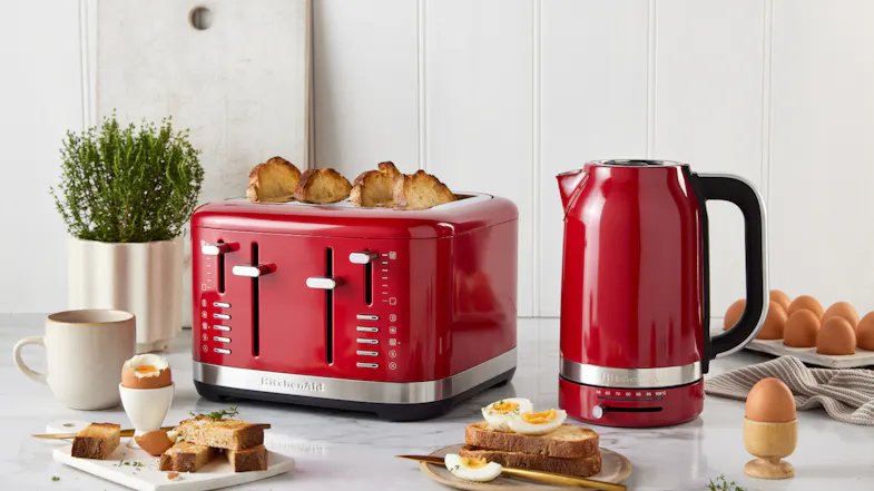 A view of the toaster displayed on a marbled kitchen countertop along with its matching kettle A view of the toaster displayed on a marbled kitchen countertop along with its matching kettle