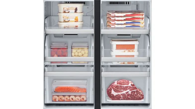 Close-up view of an open refrigerator door stocked with frozen goods Close-up view of an open refrigerator door stocked with frozen goods