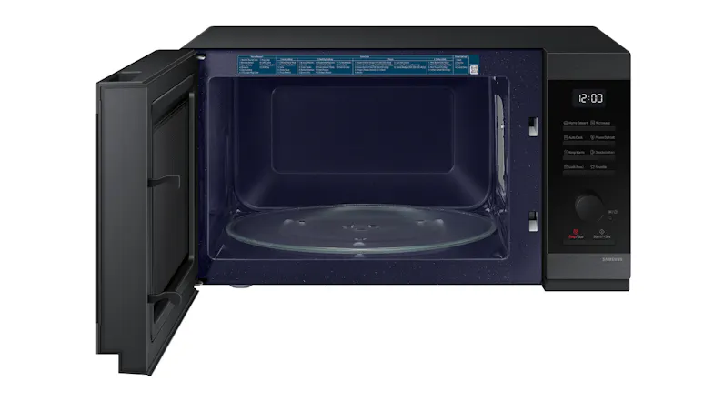 A Samsung 40L Solo microwave with a top handle slot, a digital clock, and right‑side controls A Samsung 40L Solo microwave with a top handle slot, a digital clock, and right‑side controls