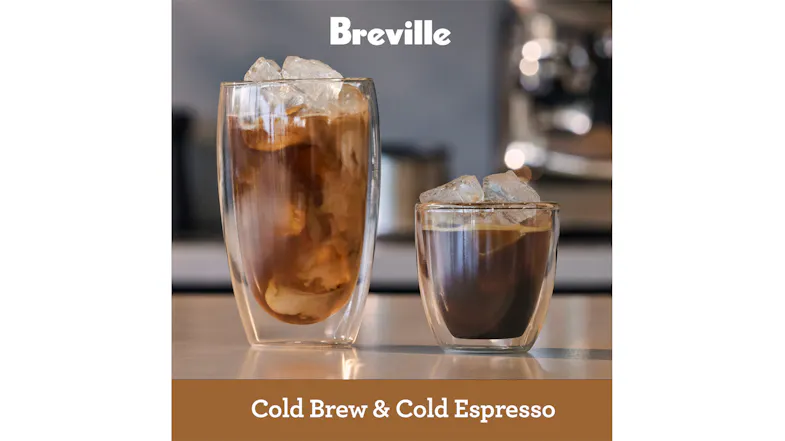 Two iced coffee drinks are in clear glasses on a counter, labelled Cold Brew and Cold Espresso Two iced coffee drinks are in clear glasses on a counter, labelled Cold Brew and Cold Espresso
