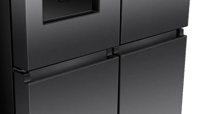 Detailed view of the recessed handles and premium dark steel finish of a Hisense Quad Door fridge Detailed view of the recessed handles and premium dark steel finish of a Hisense Quad Door fridge