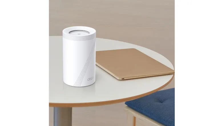 The Deco BE65 Tri-Band Mesh Wi-Fi 7 System and a laptop on a round table. The Deco BE65 Tri-Band Mesh Wi-Fi 7 System and a laptop on a round table.