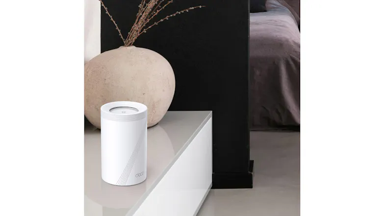 The Deco BE65 Wi-Fi 7 System sits on a shelf in a modern bedroom interior. The Deco BE65 Wi-Fi 7 System sits on a shelf in a modern bedroom interior.