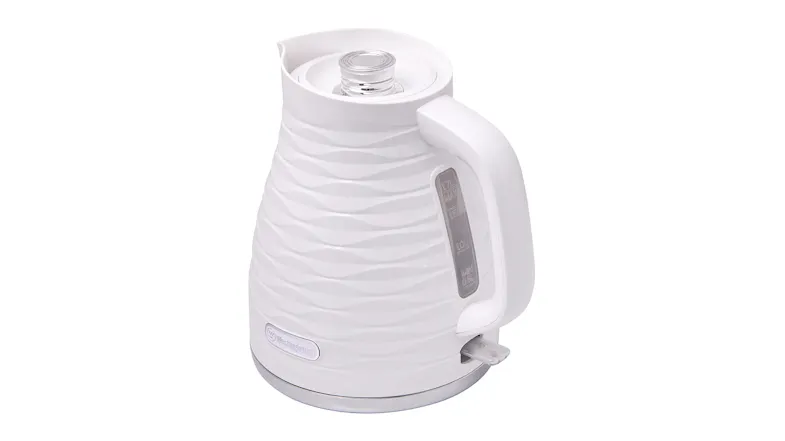An angled view of the white Westinghouse electric kettle showing the water level window An angled view of the white Westinghouse electric kettle showing the water level window
