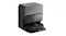 Angled front view of a robot vacuum returning to a self-cleaning dock with a textured grey front panel Angled front view of a robot vacuum returning to a self-cleaning dock with a textured grey front panel