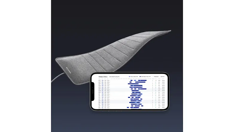 Withings sleep mat next to a phone displaying a detailed Sleep Diary chart Withings sleep mat next to a phone displaying a detailed Sleep Diary chart