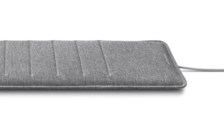 Detailed view of the sleep mat’s textured gray fabric Detailed view of the sleep mat’s textured gray fabric
