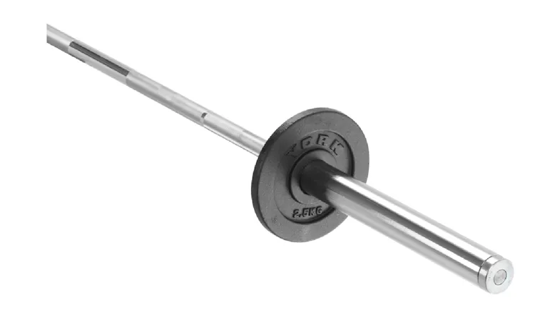 A single black cast iron York weight plate loaded onto a reflective chrome barbell sleeve A single black cast iron York weight plate loaded onto a reflective chrome barbell sleeve