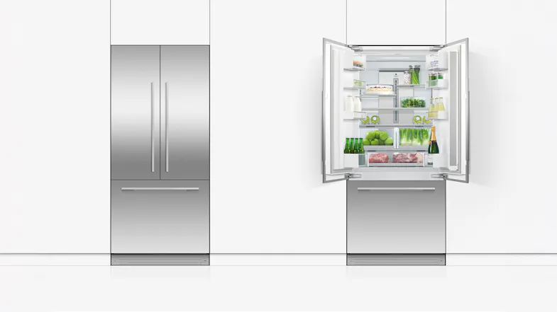 A view of the unit installed beside another fridge freezer A view of the unit installed beside another fridge freezer