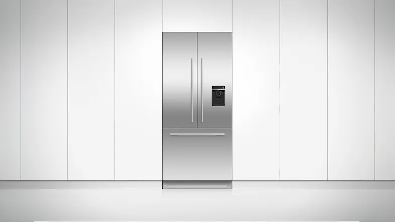 The fridge freezer installed flush on a clean white wall The fridge freezer installed flush on a clean white wall