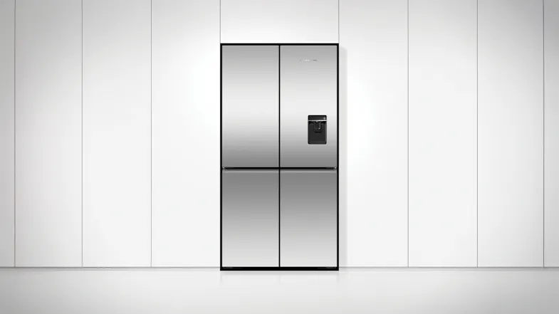 Fisher & Paykel fridge in a modern white kitchen, closed, with sleek stainless steel finish and water dispenser Fisher & Paykel fridge in a modern white kitchen, closed, with sleek stainless steel finish and water dispenser