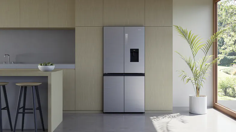 Modern kitchen featuring Haier quad door fridge in satina finish integrated beside white cabinetry Modern kitchen featuring Haier quad door fridge in satina finish integrated beside white cabinetry