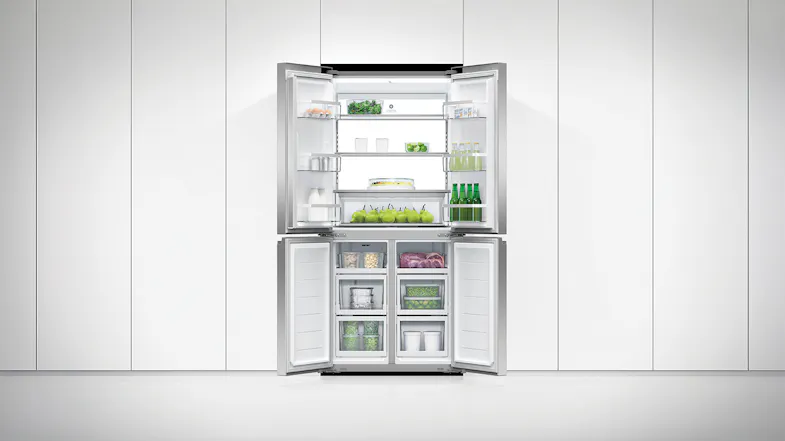 Fully stocked Fisher & Paykel Series 7 fridge in a white kitchen with all doors open Fully stocked Fisher & Paykel Series 7 fridge in a white kitchen with all doors open