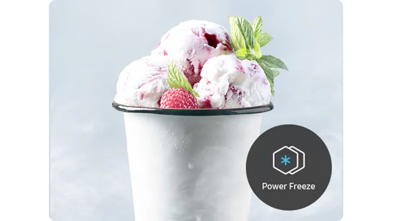 Cup of raspberry ice cream with mint leaves and a “Power Freeze” icon indicating fast freezing feature Cup of raspberry ice cream with mint leaves and a “Power Freeze” icon indicating fast freezing feature