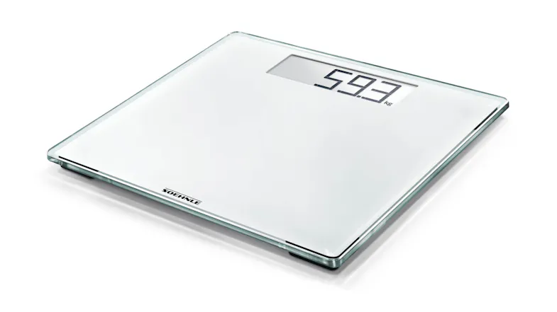 White bathroom weighing scale with LCD reading 59.3 kg White bathroom weighing scale with LCD reading 59.3 kg