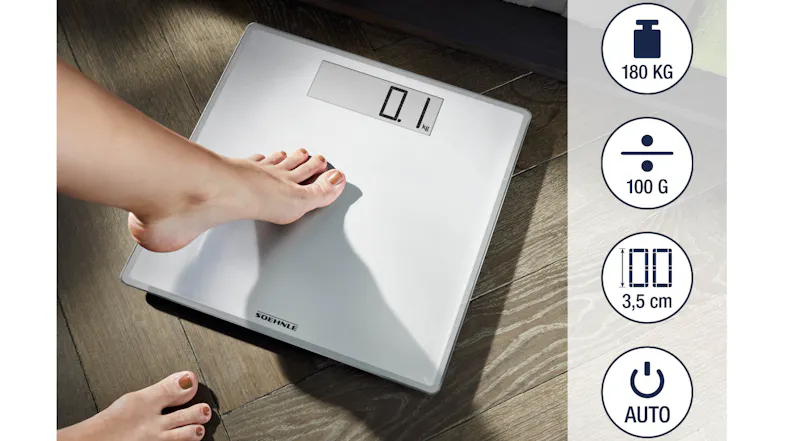 Person using a glass bathroom scale with 180 kg capacity and 100 g precision display Person using a glass bathroom scale with 180 kg capacity and 100 g precision display