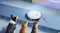 A view of three cats watching as the robot cleaner picks up pet fur on the ground A view of three cats watching as the robot cleaner picks up pet fur on the ground