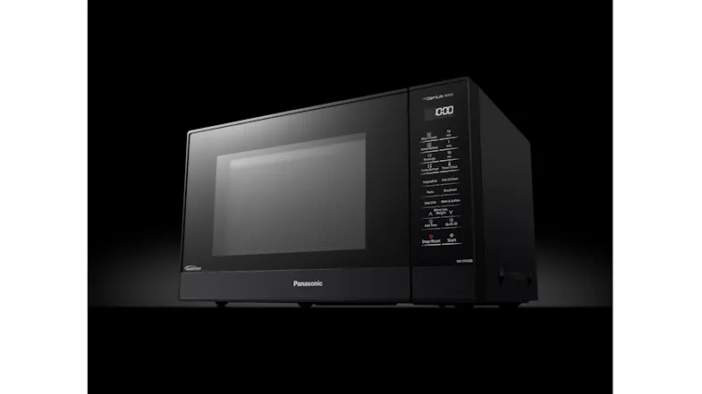 Sleek black Panasonic microwave oven with digital control panel displayed against a dark background Sleek black Panasonic microwave oven with digital control panel displayed against a dark background