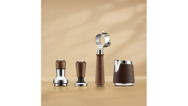 A front view of coffee tools, including two tampers, a portafilter handle, and a milk frothing pitcher. A front view of coffee tools, including two tampers, a portafilter handle, and a milk frothing pitcher.