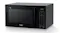 Three‑quarter front view of the Whirlpool microwave highlighting its sleek black exterior, side vents, and vertical handle Three‑quarter front view of the Whirlpool microwave highlighting its sleek black exterior, side vents, and vertical handle