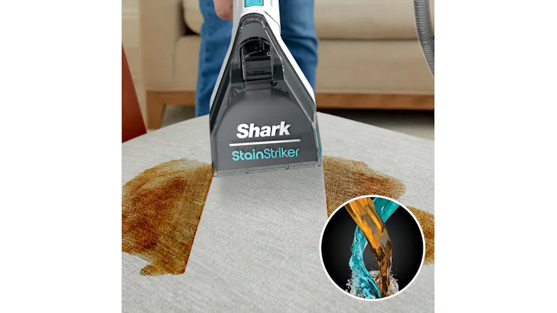 Shark StainStriker tool cleaning a large stain on upholstery, with an inset showing two liquids being poured Shark StainStriker tool cleaning a large stain on upholstery, with an inset showing two liquids being poured