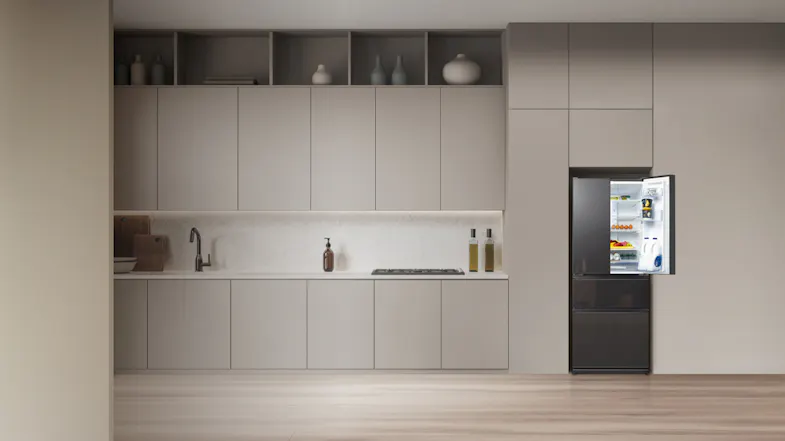 Modern kitchen with a fridge in glass gunmetal finish, integrated into minimalist cabinetry with fridge door open Modern kitchen with a fridge in glass gunmetal finish, integrated into minimalist cabinetry with fridge door open