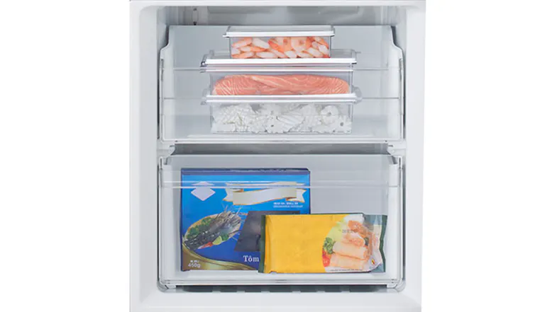 Close-up of freezer drawers storing prawns, salmon, squid, and packaged frozen food items Close-up of freezer drawers storing prawns, salmon, squid, and packaged frozen food items