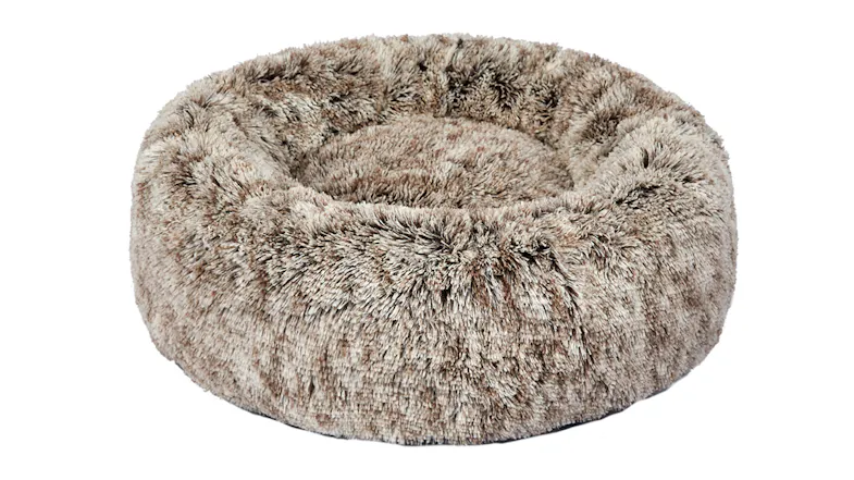 A round, fluffy, brown pet bed with raised sides and a soft, plush texture A round, fluffy, brown pet bed with raised sides and a soft, plush texture