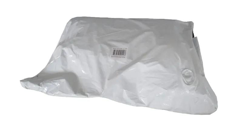 Vacuum‑sealed pet bed packed inside a white plastic bag Vacuum‑sealed pet bed packed inside a white plastic bag