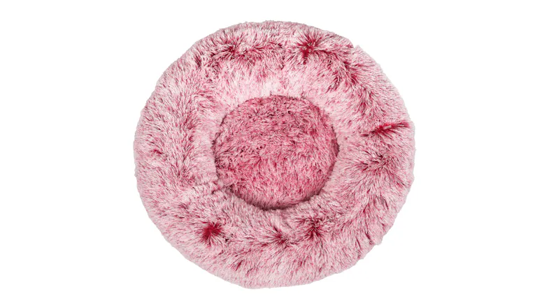 Top view of a round, fluffy pet bed with soft, shaggy fabric and a padded centre Top view of a round, fluffy pet bed with soft, shaggy fabric and a padded centre