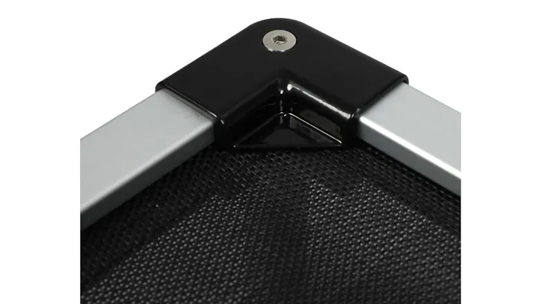 Corner view of an elevated dog bed showing a black connector and a black mesh fabric Corner view of an elevated dog bed showing a black connector and a black mesh fabric