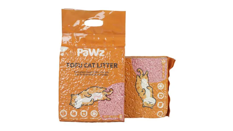 PaWz tofu cat litter packaging in orange with green pellets and an illustrated cat design, showing two bags standing together PaWz tofu cat litter packaging in orange with green pellets and an illustrated cat design, showing two bags standing together