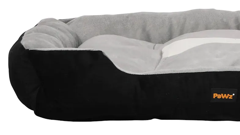 Close-up of a grey PaWz pet bed with a black base and soft padded sides Close-up of a grey PaWz pet bed with a black base and soft padded sides