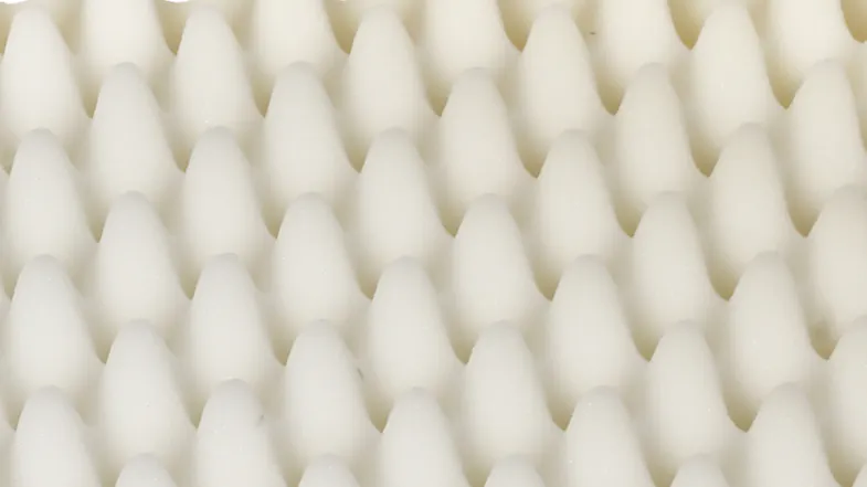 A detailed view of the egg‑crate foam used inside the pet bed A detailed view of the egg‑crate foam used inside the pet bed