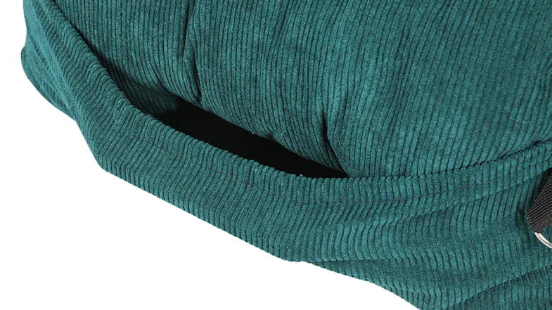 Close-up of a green corduroy pet car seat featuring a built-in side pocket for storage Close-up of a green corduroy pet car seat featuring a built-in side pocket for storage