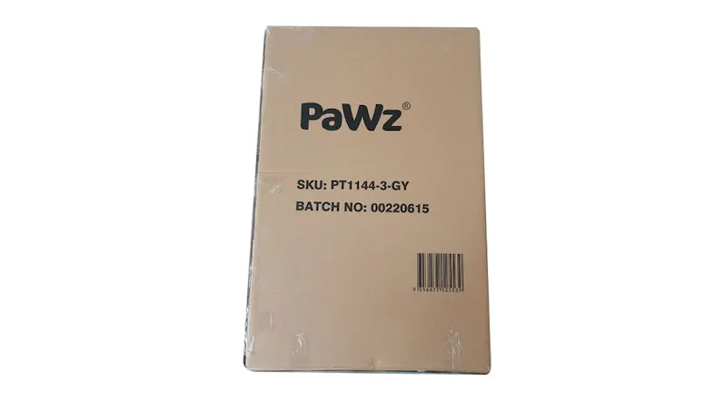 Brown cardboard box labelled PaWz with SKU PT1144-3-GY, batch number, and a printed barcod Brown cardboard box labelled PaWz with SKU PT1144-3-GY, batch number, and a printed barcod
