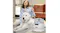 A large white dog is sitting calmly beside the grooming vacuum while someone uses the round grooming tool to brush and vacuum its coat A large white dog is sitting calmly beside the grooming vacuum while someone uses the round grooming tool to brush and vacuum its coat