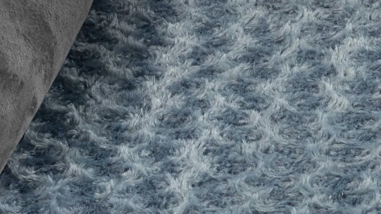 Close-up of the blue textured sleep surface of the dog bed Close-up of the blue textured sleep surface of the dog bed