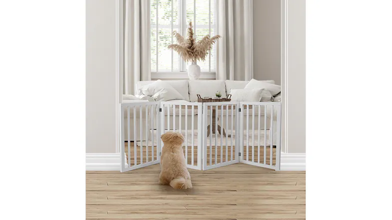 A white wooden pet gate is installed in the home doorway, blocking access while allowing visibility into the living room space A white wooden pet gate is installed in the home doorway, blocking access while allowing visibility into the living room space