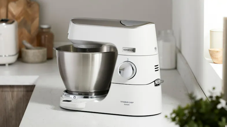 Kenwood Titanium Chef Baker XL mixer on a kitchen counter, with stainless‑steel bowl fitted and ready for use Kenwood Titanium Chef Baker XL mixer on a kitchen counter, with stainless‑steel bowl fitted and ready for use