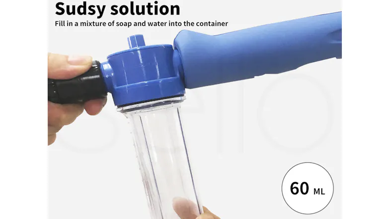 A soap container is being twisted onto the handle of the pet washer A soap container is being twisted onto the handle of the pet washer