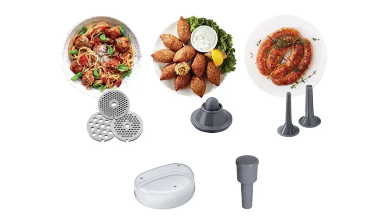 Metal grinding discs, sausage nozzles, and food on white plates Metal grinding discs, sausage nozzles, and food on white plates