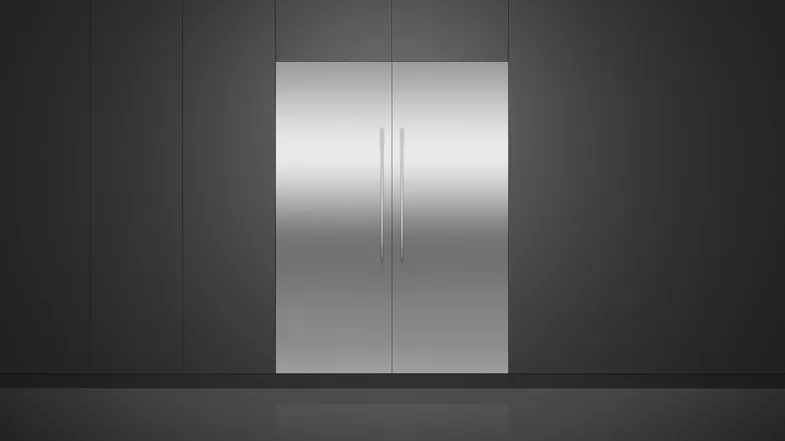 A view of the fridge and its compatible freezer installed flush on a sleek black wall A view of the fridge and its compatible freezer installed flush on a sleek black wall