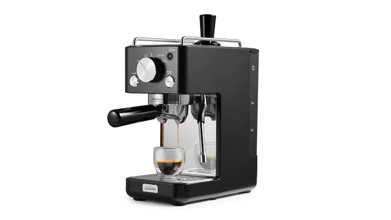 Compact Sunbeam Origins Slimline espresso maker pouring coffee into a glass cup with a steam wand Compact Sunbeam Origins Slimline espresso maker pouring coffee into a glass cup with a steam wand